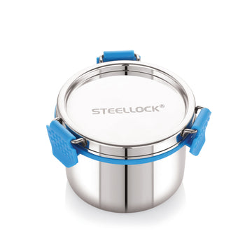 A stainless steel Steellock Pro container with a blue silicone seal lid, airtight Steellock branding on the top, and a steel lid with a blue Clip lock on the side