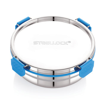 A stainless steel airtight container with a blue silicone seal lid, branded with 'STEELLOCK' on the top surface.