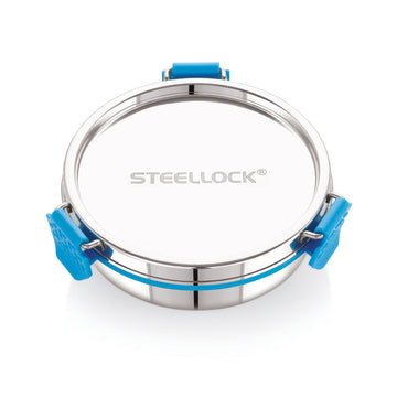 A stainless steel Steellock Pro airtight container with a blue silicone seal and a transparent lid.
