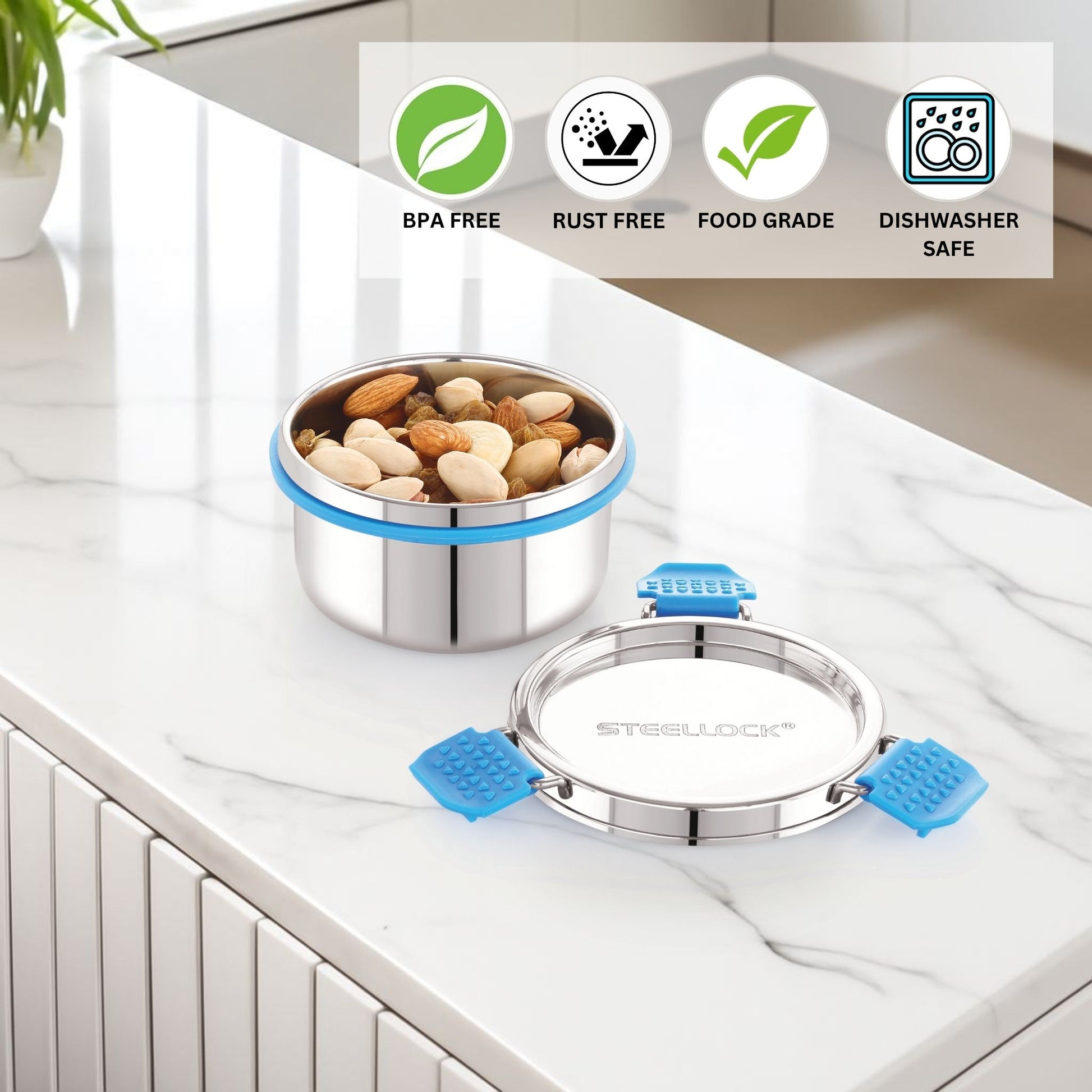 Stainless steel food container with blue silicone seals on a kitchen counter, featuring BPA-Free, Rust-Free, Food-grade, and dishwasher safe