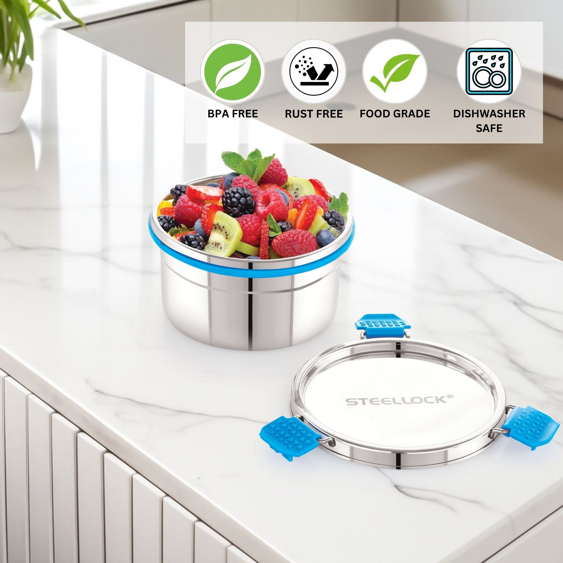 Stainless steel container with fruits on a kitchen counter, featuring 'Stellock' brand.