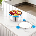 Stainless steel lunch box with fruit inside on a kitchen counter, featuring the brand 'Stellock'.