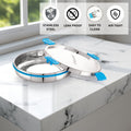 Stainless steel containers on a marble surface, featuring icons and text about material properties.