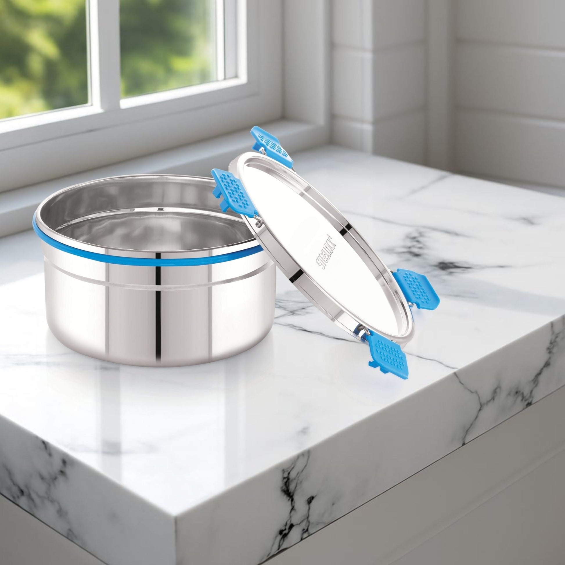 Stainless steel container on a marble surface