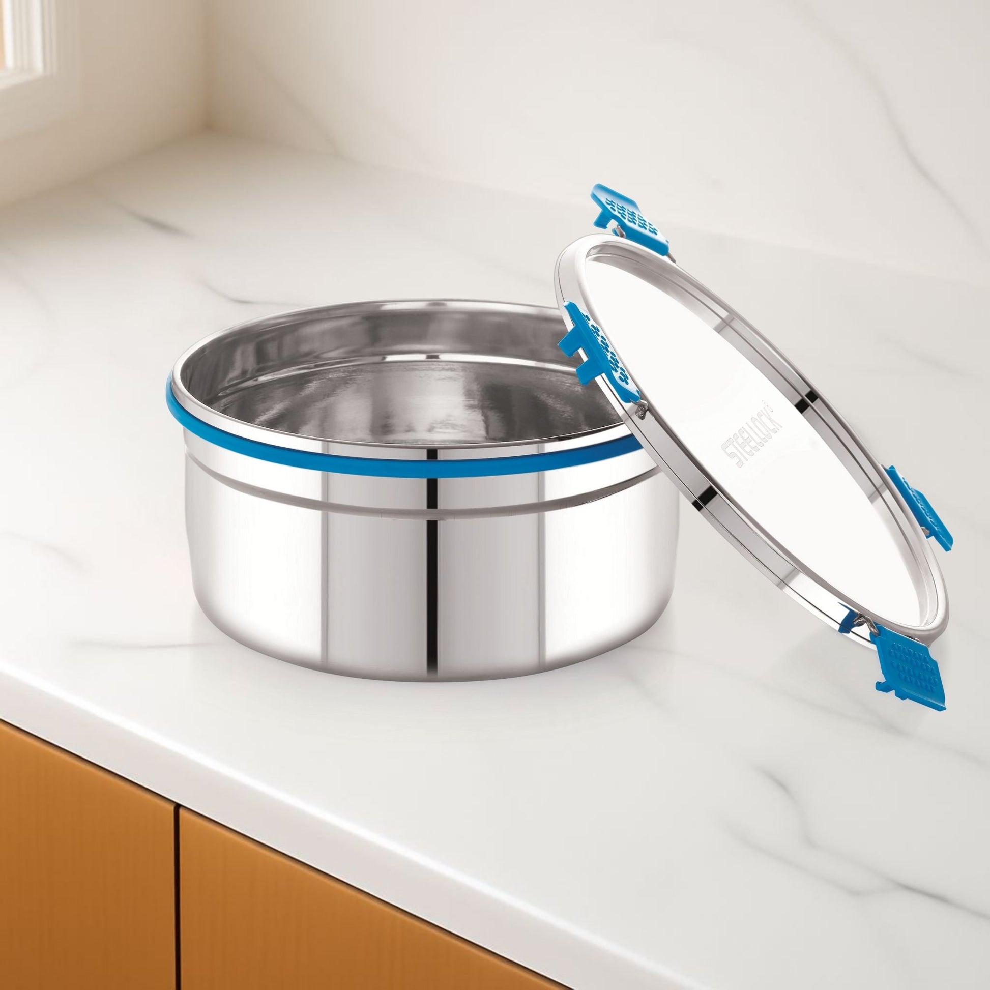 Stainless steel container with a lid on a kitchen counter
